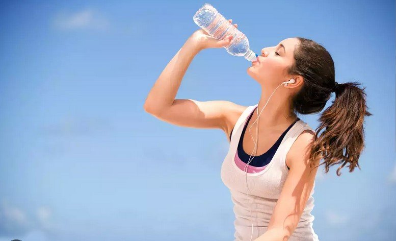 a woman drinking water